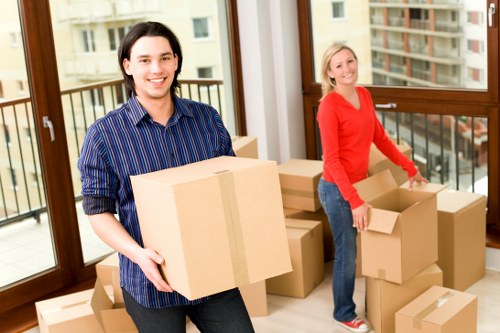 People loading furniture into a short-term storage unit